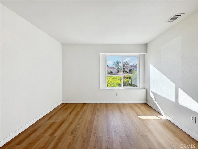 1472 N San Antonio Ave, Upland, CA 91786 - unfurnished room featuring wood finished floors and baseboards