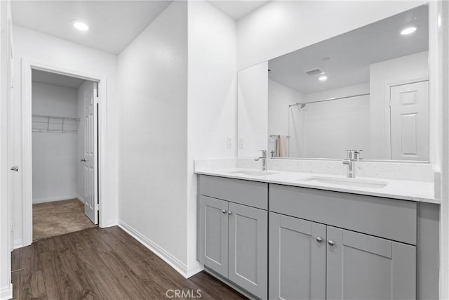 14053 Spurlock Ln Unit 3, Gardena, CA 90247 - full bath with double vanity, wood finished floors, a spacious closet, a shower, and recessed lighting