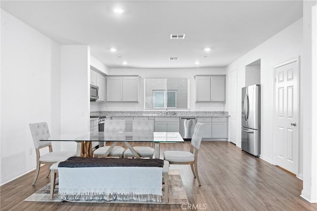 14053 Spurlock Ln Unit 3, Gardena, CA 90247 - dining area with wood finished floors and recessed lighting