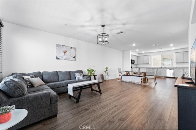 14053 Spurlock Ln Unit 3, Gardena, CA 90247 - living room featuring dark wood-style flooring and recessed lighting