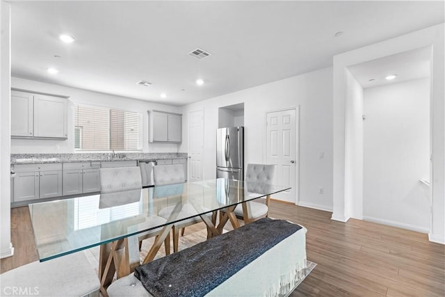 14053 Spurlock Ln Unit 3, Gardena, CA 90247 - dining area with light wood finished floors and recessed lighting