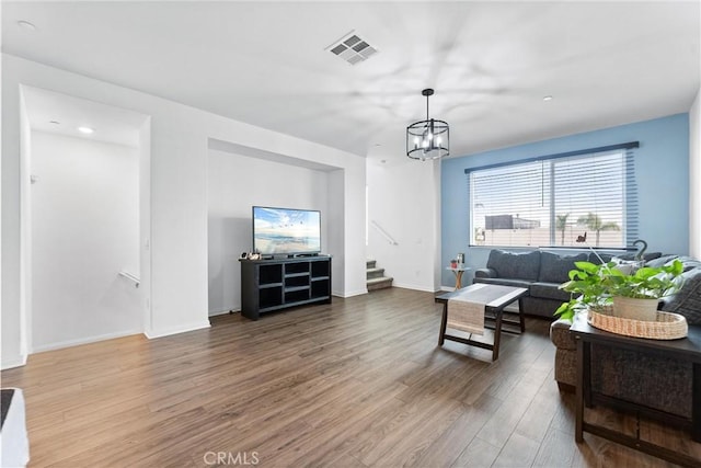 14053 Spurlock Ln Unit 3, Gardena, CA 90247 - living room featuring wood finished floors, stairway, and a chandelier