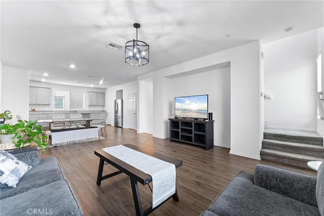 14053 Spurlock Ln Unit 3, Gardena, CA 90247 - living room featuring a chandelier, stairway, dark wood-style floors, and recessed lighting