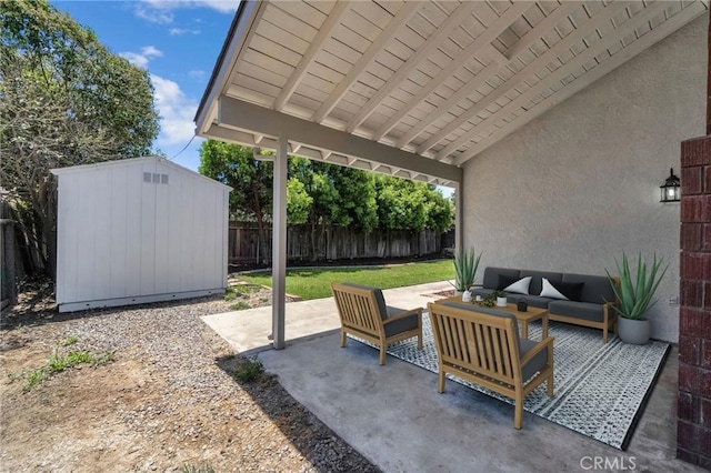1534 Princeton Ave, Madera, CA 93637 - fenced backyard with an outdoor hangout area, a storage unit, and a patio area