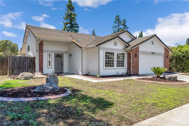 1534 Princeton Ave, Madera, CA 93637 - ranch-style house featuring brick siding, an attached garage, a tiled roof, and driveway