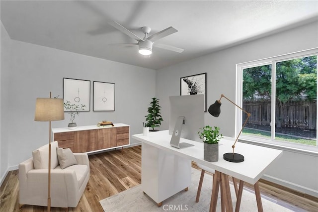 1534 Princeton Ave, Madera, CA 93637 - home office with light wood-type flooring and ceiling fan