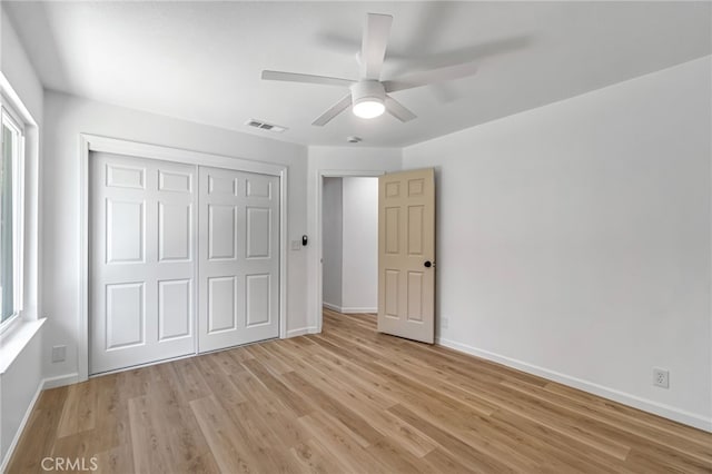 1534 Princeton Ave, Madera, CA 93637 - unfurnished bedroom with a closet, light wood-style floors, and ceiling fan