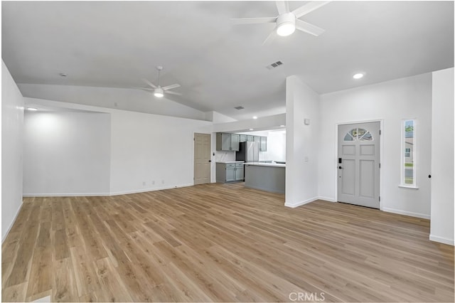 1534 Princeton Ave, Madera, CA 93637 - unfurnished living room with a ceiling fan, lofted ceiling, and light wood-style floors