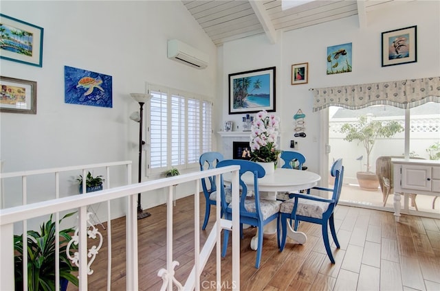 17072 5th St Unit A, Sunset Beach, CA 90742 - dining room featuring high vaulted ceiling, a fireplace, a wood ceiling with exposed beams, wood finished floors, and a wall mounted AC