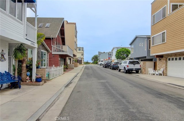 17072 5th St Unit A, Sunset Beach, CA 90742 - view of asphalt street featuring sidewalks, a residential view, and curbs