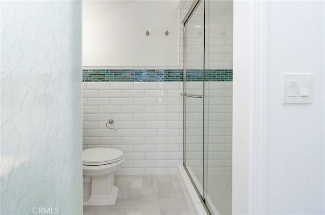 17072 5th St Unit A, Sunset Beach, CA 90742 - full bath with a shower stall, tile walls, and tile patterned flooring