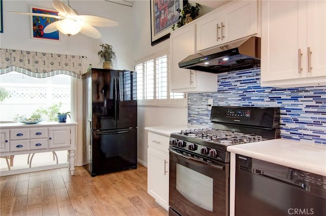 17072 5th St Unit A, Sunset Beach, CA 90742 - kitchen featuring black appliances, under cabinet range hood, a ceiling fan, and light countertops