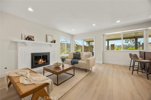 2260 Ardemore Dr, Fullerton, CA 92833 - living room featuring a fireplace, light wood-type flooring, and recessed lighting