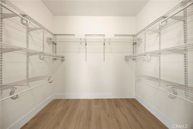 2260 Ardemore Dr, Fullerton, CA 92833 - walk in closet featuring wood finished floors