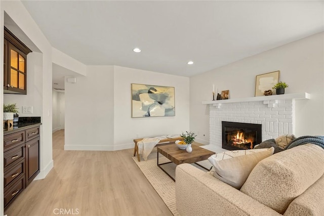2260 Ardemore Dr, Fullerton, CA 92833 - living room with light wood-style flooring, a brick fireplace, and recessed lighting