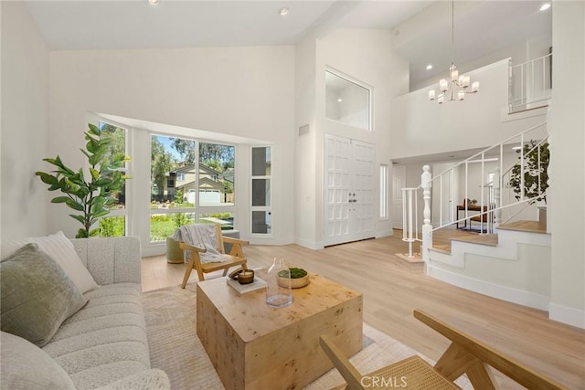 2260 Ardemore Dr, Fullerton, CA 92833 - living room featuring stairs, high vaulted ceiling, wood finished floors, a chandelier, and recessed lighting