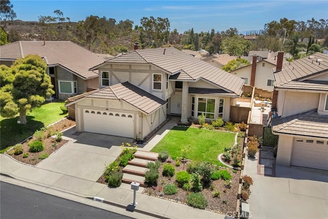 2260 Ardemore Dr, Fullerton, CA 92833 - view of front of house with stucco siding, a garage, driveway, and a residential view