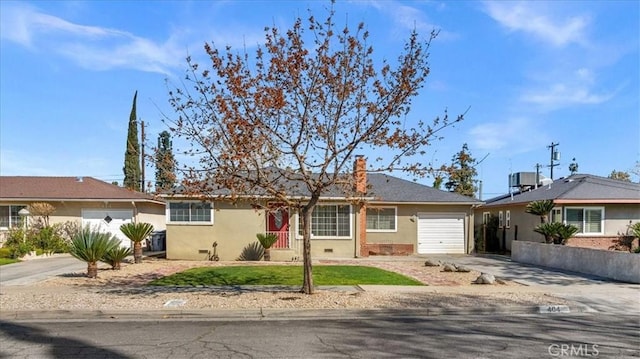 404 W Robinson Ave, Fresno, CA 93705 - ranch-style home with an attached garage, driveway, brick siding, and a chimney