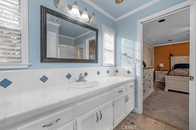 404 W Robinson Ave, Fresno, CA 93705 - full bathroom featuring ensuite bath, vanity, a shower with shower door, ornamental molding, and tile patterned floors