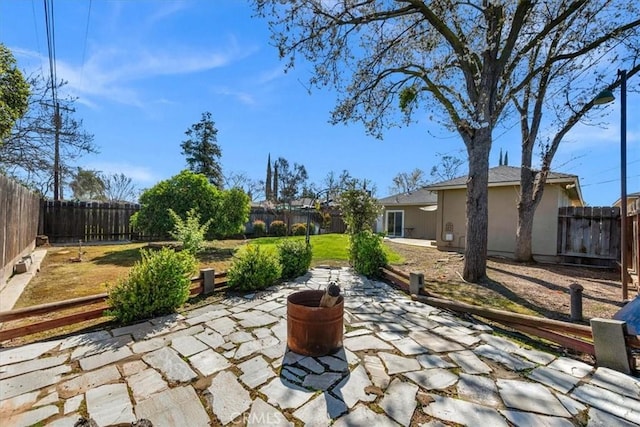 404 W Robinson Ave, Fresno, CA 93705 - fenced backyard with a patio area