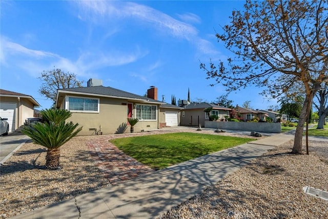 404 W Robinson Ave, Fresno, CA 93705 - ranch-style house with an attached garage, a chimney, a front lawn, stucco siding, and driveway