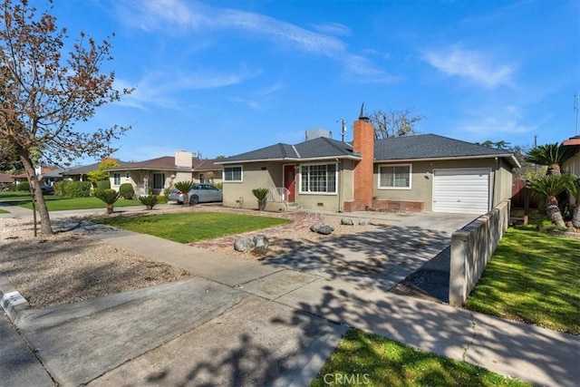 404 W Robinson Ave, Fresno, CA 93705 - ranch-style home featuring driveway, an attached garage, a front lawn, a chimney, and stucco siding