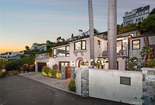 2570 Queda Way, Laguna Beach, CA 92651 - view of front of home featuring a balcony, stucco siding, driveway, and a garage
