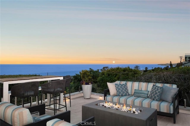 2570 Queda Way, Laguna Beach, CA 92651 - patio terrace at dusk with an outdoor living space with a fire pit and a water view