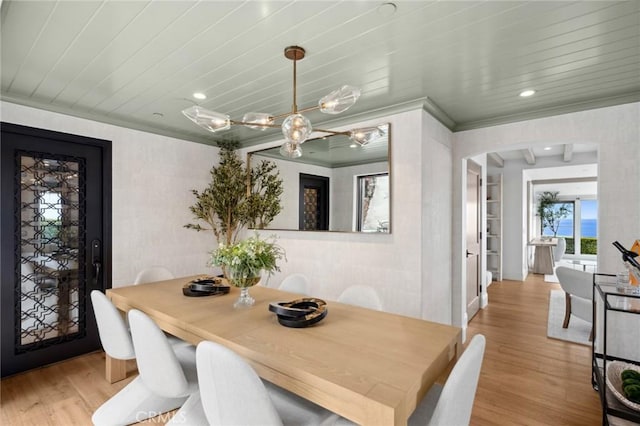 2570 Queda Way, Laguna Beach, CA 92651 - dining area with light wood-style flooring, crown molding, arched walkways, a chandelier, and recessed lighting