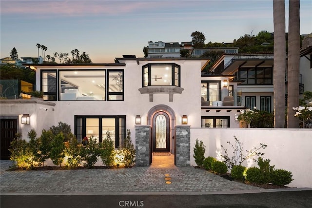 2570 Queda Way, Laguna Beach, CA 92651 - contemporary house featuring a fenced front yard, stucco siding, a gate, and a balcony
