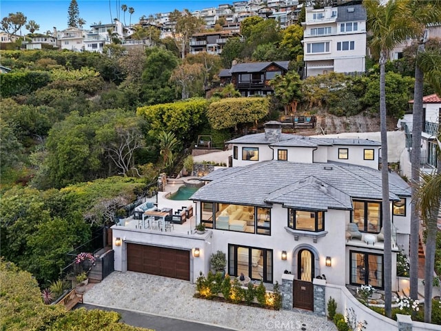 2570 Queda Way, Laguna Beach, CA 92651 - view of front of property with stucco siding, a balcony, a garage, and driveway