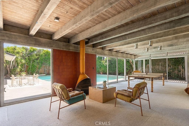 2443 Windward Ln, Newport Beach, CA 92660 - sunroom with a wood stove and beam ceiling