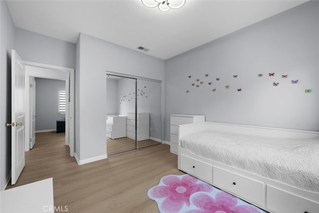 18340 Keswick St Unit 5, Reseda, CA 91335 - bedroom featuring wood finished floors and a closet