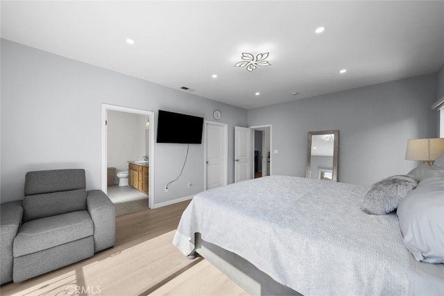 18340 Keswick St Unit 5, Reseda, CA 91335 - bedroom with wood finished floors, recessed lighting, and ensuite bathroom