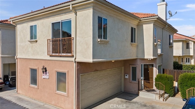 18340 Keswick St Unit 5, Reseda, CA 91335 - view of property featuring a garage