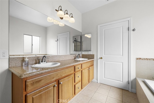 18340 Keswick St Unit 5, Reseda, CA 91335 - bathroom with double vanity, tile patterned flooring, and tiled tub