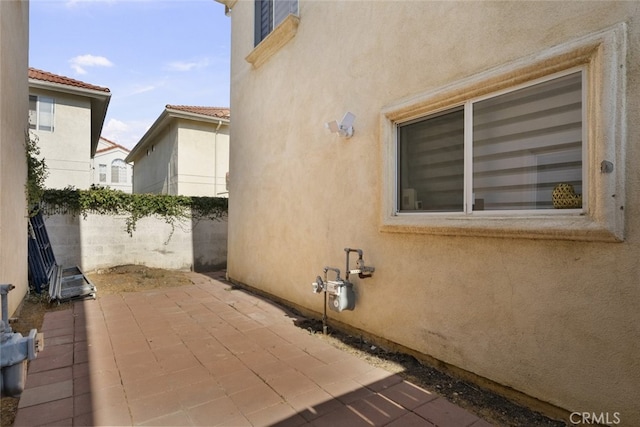18340 Keswick St Unit 5, Reseda, CA 91335 - view of property exterior with stucco siding and a patio