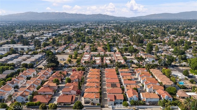 18340 Keswick St Unit 5, Reseda, CA 91335 - aerial overview of property's location featuring a mountain backdrop and nearby suburban area