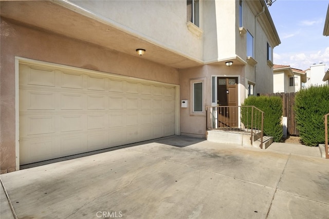 18340 Keswick St Unit 5, Reseda, CA 91335 - entrance to property featuring stucco siding, driveway, and a garage