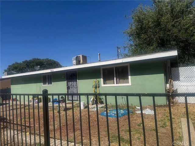 38628 Larkin Ave, Palmdale, CA 93550 - view of side of property with stucco siding and a central air condition unit