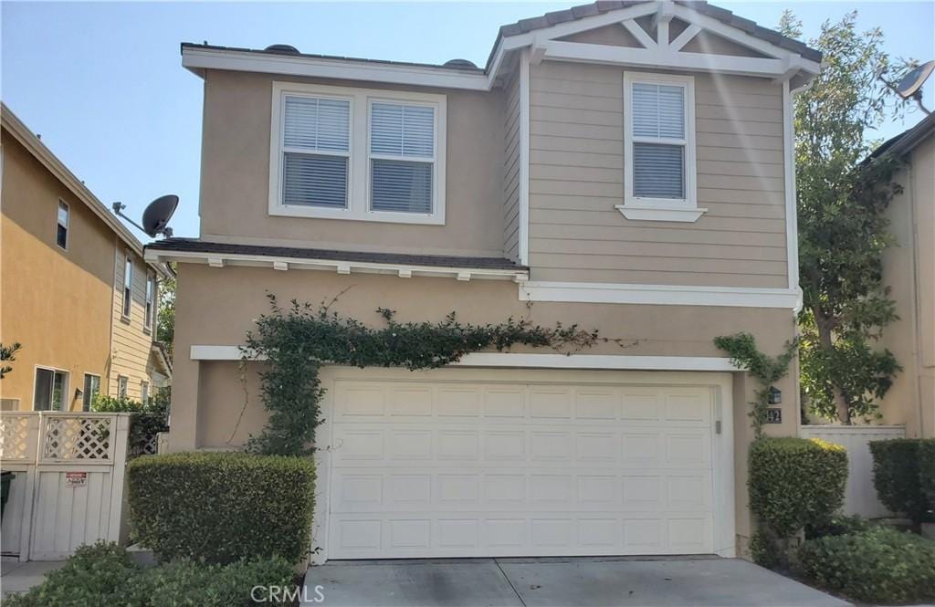 142 Main St, Ladera Ranch, CA 92694 - view of front of home featuring an attached garage, driveway, and stucco siding