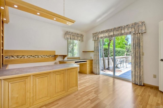61 Via Larga Vis, Bonsall, CA 92003 - kitchen featuring vaulted ceiling, light wood-style floors, recessed lighting, light brown cabinetry, and light countertops