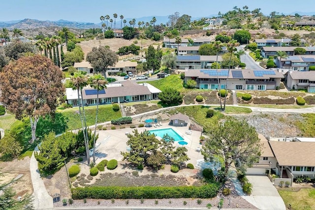 61 Via Larga Vis, Bonsall, CA 92003 - aerial perspective of suburban area with a pool area and a mountainous background