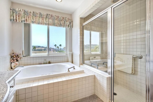 61 Via Larga Vis, Bonsall, CA 92003 - bathroom with healthy amount of natural light, a bath, a stall shower, vanity, and recessed lighting