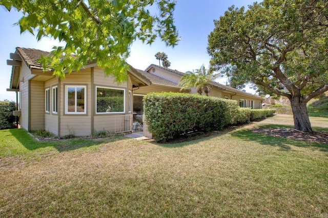 61 Via Larga Vis, Bonsall, CA 92003 - view of side of home featuring a yard