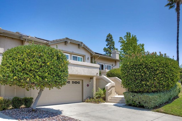 61 Via Larga Vis, Bonsall, CA 92003 - view of front facade with concrete driveway and a chimney