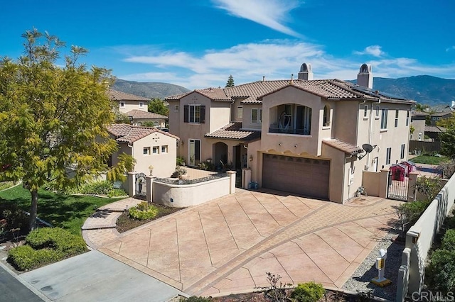 2856 Falling Waters Ct, Chula Vista, CA 91915 - mediterranean / spanish house with a gate, driveway, a chimney, and a mountain view