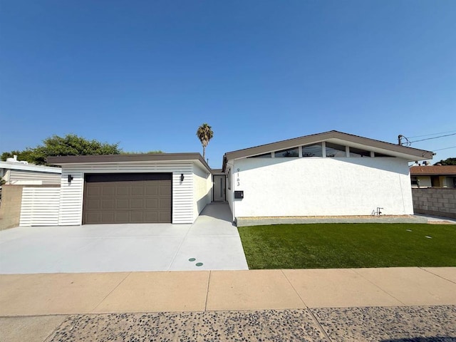 9163 Fermi Ave, San Diego, CA 92123 - view of front of home featuring driveway and a garage