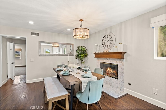 1336 Granada St, Upland, CA 91784 - dining area featuring wood finished floors, a tiled fireplace, recessed lighting, and a chandelier