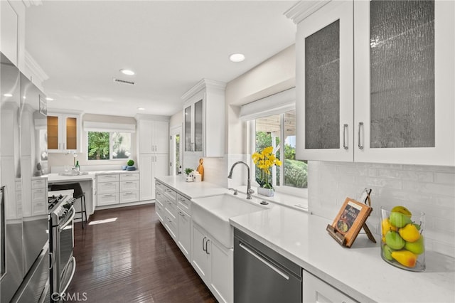1336 Granada St, Upland, CA 91784 - kitchen with plenty of natural light, light countertops, appliances with stainless steel finishes, white cabinets, and recessed lighting